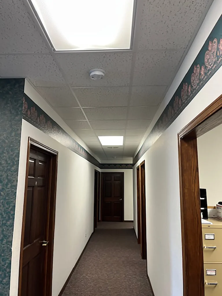 Before commercial hallway and doorway remodel by Felt's Construction