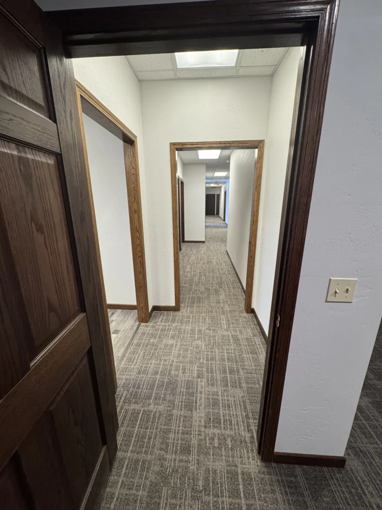 Completed commercial hallway and doors remodel by Felt's Construction